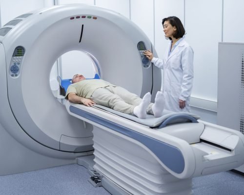 doctor-getting-patient-ready-ct-scan